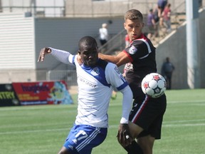 Lance Laing battles Ottawa Fury FC defender Ryan Richter for position  during NASL action in Fort McMurray on Sunday. (Robert Murray, Postmedia Network)