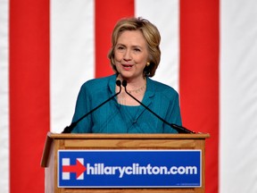 In this Friday, July 31, 2015, file photo, Democratic presidential candidate, former Secretary of State Hillary Rodham Clinton, calls on Congress to end the trade embargo the U.S. has imposed against Cuba since 1962, during a campaign stop at Florida International University in Miami. Clinton is airing the first television ads of her presidential race, which are scheduled for Tuesday, Aug. 4, 2015. AP Photo/Gaston De Cardenas/File