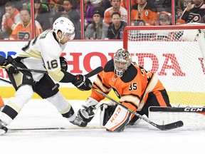 Philadelphia Flyers goalie Steve Mason (35) makes a save on Pittsburgh Penguins centre Brandon Sutter during NHL play at Wells Fargo Center. (Eric Hartline/USA TODAY Sports)