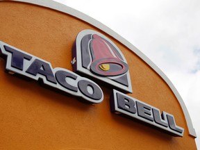 This Friday, May 23, 2014, file photo, shows the sign at a Taco Bell in Mount Lebanon, Pa. (AP Photo/Gene J. Puskar, File)
