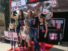 Fans pose for pictures outside Rexall Place at the Taylor Swift concert on Tuesday, August 4, 2015 in Edmonton, AB. Trevor Robb/Edmonton Sun/Postmedia Network