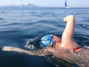 Ashleigh Beaton, of Komoka, Ontario heads towards the Toronto shoreline during her 2013 solo swim across Lake Ontario. She and seven other swimmers will be completing a relay twice across the lake to raise money for Canadian Tire's Jumpstart program.