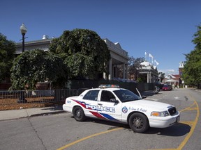 A police cruiser sits outside of the Muzik nightclub where a shooting happened in the early morning, in Toronto, August 4, 2015. (REUTERS/Mark Blinch)