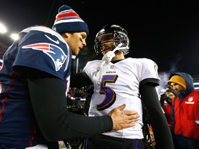 Joe Flacco #5 of the Baltimore Ravens and Tom Brady #12 of the New England Patriots hug following the 2015 AFC Divisional Playoffs game at Gillette Stadium on January 10, 2015 in Foxboro, Massachusetts.   Jared Wickerham/Getty Images/AFP