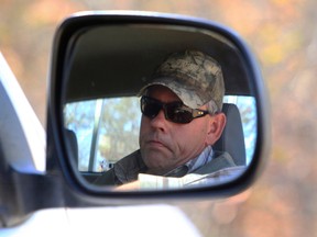 Professional hunter Theodore Bronkhorst sits in his car upon his arrival at the magistrates courts to face trial in Hwange, Zimbabwe, on Aug. 5, 2015. (AP Photo/Tsvangirayi Mukwazhi)