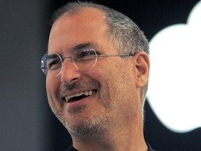 In this Sept. 20, 2005 file photo, Apple co-founder Steve Jobs smiles after a press conference as he opens the Apple Expo in Paris. (AP Photo/Christophe Ena, File)