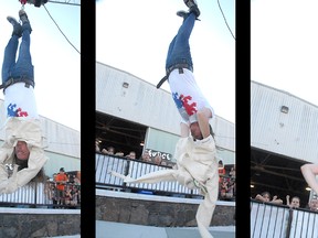 Lucas Wilson sets a new world record at the 2011 Norfolk County Fair wiggling out of a straitjacket while suspended upside down, wrapped in a chain, in 19.2 seconds. (DANIEL PEARCE/Simcoe Reformer)