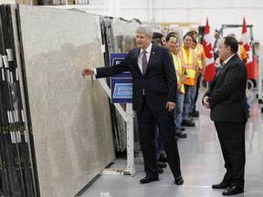 Canada's Prime Minister Stephen Harper visits a tile and stone manufacturing company in Toronto August 4, 2015. Harper, running for reelection in October, said on Tuesday he would refrain from applying fresh taxes on the embattled energy sector and promised to bring back a popular home renovation tax credit. REUTERS/Chris Helgren