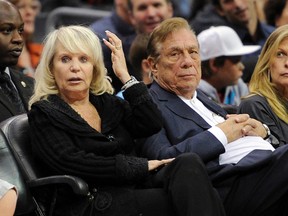 In this Nov. 12, 2010, file photo, Shelly Sterling, left, sits with her husband, Los Angeles Clippers owner Donald Sterling, during their game against the Detroit Pistons in Los Angeles. (AP Photo/Mark J. Terrill, File)