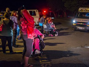 Residents of 523 Portsmouth Ave. await outside 523 Portsmouth Ave for it to be safe to return. Kendra Piorrez for the Kingston Whig-Standard.