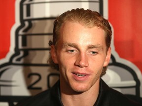 Chicago Blackhawks' Patrick Kane speaks with reporters during the NHL hockey team's annual convention, Friday, July 17, 2015, in Chicago. (Daniel White/Daily Herald via AP)