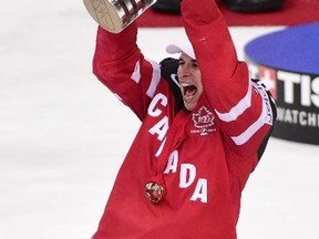 Forward Sidney Crosby of Canada raises the trophy of the IIHF Ice Hockey World Championship after winning the IIHF Ice Hockey World Championship final match Canada vs Russia on May 17, 2015 at the O2 Arena in Prague.  AFP PHOTO / JONATHAN NACKSTRAND