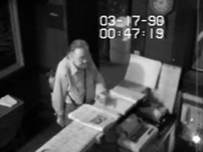 An unidentified man is seen allegedly being allowed inside the Isabella Stewart Gardner Museum in Boston, against Museum policy, by a security guard, in a still image taken from security video taken March 17, 1990 and released by the FBI August 6, 2015. The event occurred almost exactly 24 hours before thieves entered the museum through the same door and stole 13 works of art worth an estimated $500 million, the FBI said. Law enforcement officials hope that releasing the footage will assist with identifying the man or the vehicle in the video, according to an FBI news release.  REUTERS/FBI/Handout