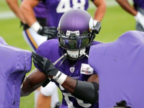 Minnesota Vikings running back Adrian Peterson wears a camera on the side of his helmet during the team’s training camp workout on the campus of Minnesota State University Tuesday, July 28, 2015, in Mankato, Minn. (AP Photo/Charles Rex Arbogast)