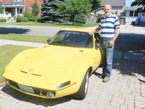 Goderich resident PJ Romano stands with his classic 1972 Opel GT. Romano retired on June 30 after more than 40 years in the grader sales industry, including 30 years at the Goderich plant. The same day, Volvo produced its at last grader at its Shippensburg, PA plant.