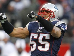 New England Patriots linebacker Junior Seau celebrates after sacking San Diego Chargers quarterback Philip Rivers during the AFC championship game in Foxboro, Mass., in this January 20, 2008 this file photo. (REUTERS/Brian Snyder/Files)