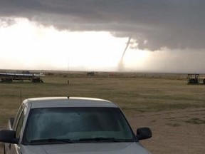 A snapshot of a tornado that Environment Canada confirmed touched down near the village of Foremost, Alta. on Thursday, Aug. 6, 2015. (@ryanm4m/Twitter )
