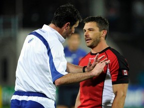 Referee Craig Joubert (left) penalizes Canada’s James Pritchard during a Rugby World Cup match against France at McLean Park in Napier September 18, 2011. (REUTERS/Anthony Phelps)