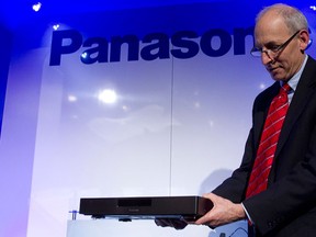 Dan Unger, corporate communications manager at Panasonic, holds a 4K Blu-ray player at a Panasonic news conference during the 2015 International Consumer Electronics Show (CES) in Las Vegas,  Jan. 5, 2015. REUTERS/Steve Marcus