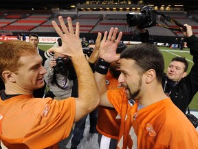 Travis Lulay, left, says he has touched base with former teammate and Eskijmos QB Mike Reilly to offer encouragement as Reilly recovers from injury. (Reuters)