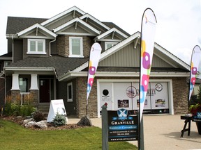 The Edmonton dream home for the 2015 Cash & Cars Lottery is seen on Ginsburg Cresent in Edmonton's west-end on Thursday Aug. 6, 2015. Cash and Cars Lottery 2015 is produced by the Alberta Cancer Foundation. The foundation is the official fundraising partner for 17 cancer centres in Alberta, including the Cross Cancer Institute in Edmonton and the Baker Cancer Centre in Calgary. Claire Theobald/Edmonton Sun