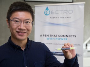 Nectro co-founder Tengyuan Zhang holds the company?s pen, which can draw working electric circuits. (DEREK RUTTAN, The London Free Press)