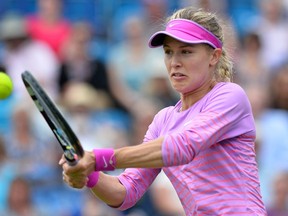 Canada’s Eugenie Bouchard returns the ball to Alison Riske during their second-round match at the WTA Eastbourne International tournament in Eastbourne, England on June 23, 2015. (AFP PHOTO/GLYN KIRK)