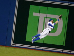 Kevin Pillar makes a huge catch off Miguel Sano in the 7th inning as Blue Jays beat the Minnesota Twins at Rogers Centre on August 6, 2015. (Michael Peake/Toronto Sun/Postmedia Network)