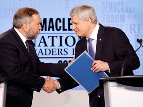 Canada's NDP leader Thomas Mulcair (left) shakes hands with Conservative leader Prime Minister Stephen Harper after the Maclean's National Leaders debate in Toronto, August 6, 2015. THE CANADIAN PRESS/POOL-Mark Blinch