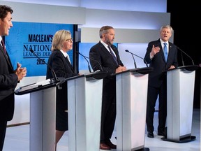 Liberal leader Justin Trudeau (L), Green Party leader Elizabeth May (2nd L) and New Democratic Party leader Thomas Mulcair listen as Conservative Leader Stephen Harper (R) speaks during the first leaders' debate in Toronto August 6, 2015 . REUTERS/Frank Gunn/Pool
