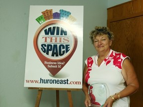 Jan Hawley holds the award given by the Huron East Council for her part in the success of “Win This Space.”(Shaun Gregory/Huron Expositor)