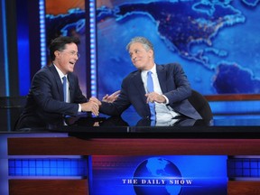 Stephen Colbert and Jon Stewart appear on "The Daily Show with Jon Stewart" #JonVoyage on August 6, 2015 in New York City. (Brad Barket/Getty Images for Comedy Central/AFP)