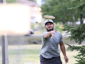 Andrew Chiswell, concentrates as he shoots his disc at the Lions Club of Sudbury Disc Golf Course in Sudbury, Ont. on Thursday, August 6, 2015. For more information on disc golf and local leagues email sudburydiscgolf@gmail.com. Gino Donato/Sudbury Star/Postmedia Network