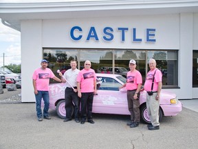 Service groups and local businesses banded together to create a pink car. They are selling tickets to smash the vehicle to raise money for the Wild Pink Yonder. Shown: Darrin Leffingwell from Fix Auto, Pete Schauerte from Castle Ford, Charlie Price from the Elks, George Wolstenholme from Castle Ford, and Ken Neumann from the Elks. John Stoesser photos/Pincher Creek Echo.