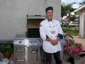 Third-prize winner of the Canadian Food Championship Joe Holzer stands next to his barbecue at his home in Stony Plain on Thursday, July 30. Holzer loves to barbecue and his chicken and wild rice burger is what won him his bronze medal in the burger category. - Yasmin Mayne, Reporter/Examiner