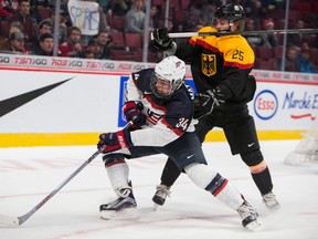 Auston Matthews of the U.S. battles for the puck with Germany’s Fabio Pfohl during the 2015 World Junior Championship on December 28, 2014 at the Bell Centre in Montreal. (Postmedia Network file photo)