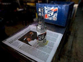 In this Tuesday, July 28, 2015 photo, an empty Polar beer bottle sits on the counter of a liquor store after it was returned by a customer in Caracas, Venezuela. (AP Photo/Fernando Llano)