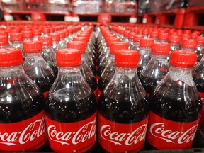 Bottles of Coca-Cola are seen in a warehouse in Draper, Utah, in this file photo taken March 9, 2011. (REUTERS/George Frey/Files)