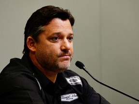 Tony Stewart speaks during a press conference to discuss the grand jury clearing him of any charges in the death of Sprint Car driver Kevin Ward Jr.  (Grant Halverson/AFP)