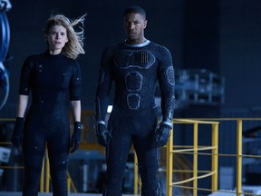 This photo provided by Twentieth Century Fox shows, Kate Mara, left, as Sue Storm, and Michael B. Jordan as Johnny Storm, in a scene from the film, "Fantastic Four." The movie releases in U.S. theaters on Friday, Aug. 7, 2015. (Ben Rothstein/Twentieth Century)