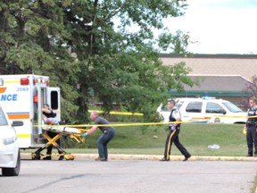 Police and emergency crews respond to a shooting at the Provincial Building in Edson on Friday .  Ed Moore/Edson Leader/Postmedia Network