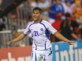 Jul 11, 2015; Houston, TX, USA; El Salvador midfielder Dustin Corea (21) celebrates after scoring a goal during stoppage time against Costa Rica during CONCACAF Gold Cup group play at BBVA Compass Stadium. El Salvador and Costa Rica played to a 1-1 tie. Mandatory Credit: Troy Taormina-USA TODAY Sports