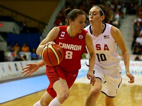 Kim Gaucher drives past a U.S. player at the gold medal match at the Pan American Games. (Dave Abel, Postmedia Network)