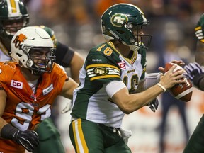Edmonton Eskimos QB Matt Nichols (R) is sacked by DL Craig Roh of the B.C Lions during the second half of their CFL football game in Vancouver, British Columbia, August 6, 2015. REUTERS/Ben Nelms