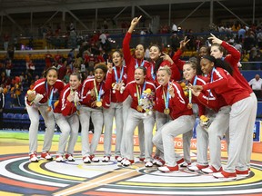 Team Canada celebrates its gold medal win at the Pan American Games in Toronto in July. The team turns its eyes to an Olympic berth, awarded to the top team at the FIBA Americas Championship. (Dave Abel, Postmedia Network)
