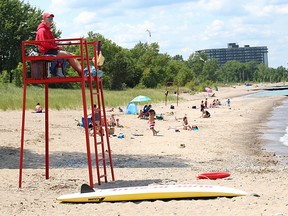 Lifeguard Ryan Tanner keeps watch at Canatara Beach in Sarnia Friday. Fewer students are interested in lifeguard jobs across Ontario, causing a baffling trend for provincial water safety advocates. Tyler Kula/Sarnia Observer/Postmedia Network