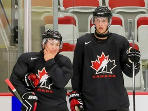 Joe Hicketts (left) and Travis Sanheim get ready for a drill in Calgary last week. Hicketts should be one of the candidates to captain Team Canada at the world junior in Helsinki. (Lyle Aspinall/postmedia network)