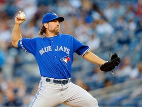R.A. Dickey of the Toronto Blue Jays pitches in the first inning against the New York Yankees at Yankee Stadium on August 7, 2015 in the Bronx borough of New York City.  (Jim McIsaac/AFP)