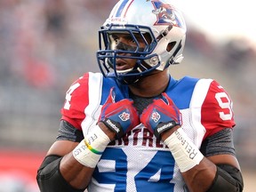 Montreal Alouettes' Michael Sam is set to make his pro football debut as he warms up before the first half of a CFL game against the Ottawa Redblacks in Ottawa on Friday, Aug. 7, 2015. THE CANADIAN PRESS/Justin Tang