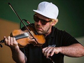 Ashley MacIsaac entertains the crowd at Gallagher Park Friday night. (Codie McLachlan)